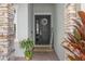 Elegant front entry with stone pillars, a decorative wreath, and a 'Welcome' sign at 944 Flyer St, Orange City, FL 32763