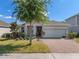 Charming single-Gathering home with well-manicured landscaping and a brick driveway, offering curb appeal at 944 Flyer St, Orange City, FL 32763