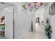 Bright hallway with colorful lantern decorations, tile flooring, and ample space at 944 Flyer St, Orange City, FL 32763