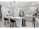 Bright, open kitchen with stainless steel appliances, a large island, and pendant lighting at 944 Flyer St, Orange City, FL 32763
