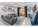 Inviting living room featuring a comfortable sectional sofa and sliding glass doors to the outdoor space at 944 Flyer St, Orange City, FL 32763