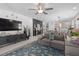 Spacious living room with large TV, contemporary decor, and a comfortable sectional sofa at 944 Flyer St, Orange City, FL 32763