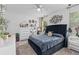 Serene main bedroom with a plush bed, decorative artwork, and natural light from a window at 944 Flyer St, Orange City, FL 32763
