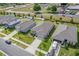 Aerial view showcases a landscaped neighborhood with well-maintained homes and convenient street parking at 1030 Alabaster Way, Deltona, FL 32725