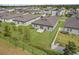 Aerial view of a home with a spacious backyard, landscaping, and privacy fencing at 1030 Alabaster Way, Deltona, FL 32725