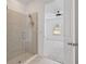 Bathroom with a glass-enclosed shower and an open view to the bedroom at 1030 Alabaster Way, Deltona, FL 32725