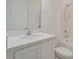 Bright bathroom with white vanity, modern faucet, and shower-tub combination, offering a clean aesthetic at 1030 Alabaster Way, Deltona, FL 32725