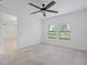 Bright bedroom with a ceiling fan and natural light streaming through the windows at 1030 Alabaster Way, Deltona, FL 32725