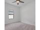 Neutral-toned bedroom with carpet and a ceiling fan at 1030 Alabaster Way, Deltona, FL 32725