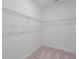Walk-in closet with wire shelving and neutral carpet, ready for organization at 1030 Alabaster Way, Deltona, FL 32725