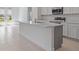 Spacious kitchen with a large island, stainless steel appliances, and lots of natural light at 1030 Alabaster Way, Deltona, FL 32725