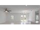 Bright open-concept living room with white walls and recessed lighting at 1030 Alabaster Way, Deltona, FL 32725
