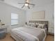 Inviting main bedroom with a ceiling fan, carpet, and calming decor for a peaceful retreat at 1030 Alabaster Way, Deltona, FL 32725