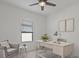 Bright office space with a desk, chair, and window, perfect for focused work or study at 1030 Alabaster Way, Deltona, FL 32725