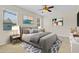 Comfortable bedroom with ceiling fan, neutral paint, and two windows at 1162 Lebanon Ct, Sanford, FL 32771