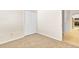 Light-filled bedroom features neutral carpet and a closet with double doors at 1162 Lebanon Ct, Sanford, FL 32771