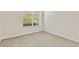 Carpeted bedroom with bright natural light from large window at 1162 Lebanon Ct, Sanford, FL 32771