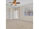 Expansive bedroom with neutral walls and carpet, natural light and multiple doors at 1162 Lebanon Ct, Sanford, FL 32771