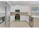 Bright kitchen with white cabinetry, granite countertops, stainless steel appliances at 1162 Lebanon Ct, Sanford, FL 32771
