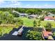 An aerial shot showcases waterfront homes, lush landscaping, and a tranquil lake setting at 13638 Sunset Lakes Cir, Winter Garden, FL 34787