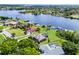 Lakefront homes featuring well-maintained lawns, private docks, and beautiful water views at 13638 Sunset Lakes Cir, Winter Garden, FL 34787
