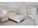 Comfortable bedroom with large bed, nightstand, plush carpet, and doorway to other rooms at 13638 Sunset Lakes Cir, Winter Garden, FL 34787