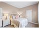Charming bedroom with a neutral color scheme, white furniture, and soft lighting at 13638 Sunset Lakes Cir, Winter Garden, FL 34787
