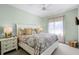 Inviting bedroom with soft green walls, patterned bedding, and a bright, airy feel at 13638 Sunset Lakes Cir, Winter Garden, FL 34787