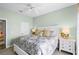 Comfortable bedroom with neutral decor, white furniture, and ceiling fan at 13638 Sunset Lakes Cir, Winter Garden, FL 34787