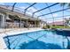 Sparkling pool with spa overlooking a beautiful backyard at 13638 Sunset Lakes Cir, Winter Garden, FL 34787