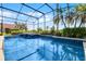 Inviting pool with lush landscaping providing a private outdoor retreat at 13638 Sunset Lakes Cir, Winter Garden, FL 34787