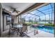 Relaxing covered pool area with view of the lake and private spa at 13638 Sunset Lakes Cir, Winter Garden, FL 34787