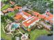 Overhead view of resort-style community offering multiple swimming pools and lush tropical landscaping at 1390 Harbor Ridge Dr, Kissimmee, FL 34759