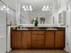 Bathroom featuring dual sinks, and a large mirror at 1390 Harbor Ridge Dr, Kissimmee, FL 34759