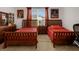 Comfortable bedroom featuring two beds, warm lighting, and closet space at 1390 Harbor Ridge Dr, Kissimmee, FL 34759