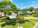 Beautiful single-story home with a large, well-manicured front lawn, and three-car garage at 203 Prestwick Dr, New Smyrna Beach, FL 32168