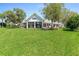 Lush green lawn and spacious backyard ideal for outdoor activities and entertaining at 203 Prestwick Dr, New Smyrna Beach, FL 32168