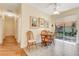 Charming breakfast nook with cozy seating and sliding glass doors, perfect for casual dining at 203 Prestwick Dr, New Smyrna Beach, FL 32168