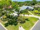 Beautiful home with lush landscaping, a well-manicured lawn, and a spacious driveway at 203 Prestwick Dr, New Smyrna Beach, FL 32168