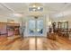 Elegant foyer with hardwood floors, decorative lighting, and a view into formal living spaces at 203 Prestwick Dr, New Smyrna Beach, FL 32168