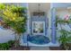 Inviting front entrance featuring double doors, blue accents, and decorative plants at 203 Prestwick Dr, New Smyrna Beach, FL 32168