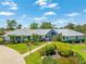 Beautiful home with well-manicured lawn, mature landscaping, and a welcoming entrance at 203 Prestwick Dr, New Smyrna Beach, FL 32168