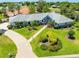 Stunning front exterior showcasing a lush landscaped yard and a charming home design at 203 Prestwick Dr, New Smyrna Beach, FL 32168
