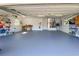 Spacious three-car garage with epoxy floors, modern utilities, and ample storage space at 203 Prestwick Dr, New Smyrna Beach, FL 32168