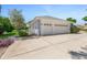 Spacious three-car garage with white doors, complementing the home's exterior at 203 Prestwick Dr, New Smyrna Beach, FL 32168