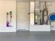 Clean garage with epoxy floors, modern utilities and a white door at 203 Prestwick Dr, New Smyrna Beach, FL 32168