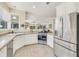 Updated kitchen with stainless steel appliances, lots of counter space, and a sunny breakfast nook at 203 Prestwick Dr, New Smyrna Beach, FL 32168