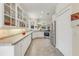 Bright eat-in kitchen featuring sleek stainless steel appliances and ample cabinet space for storage at 203 Prestwick Dr, New Smyrna Beach, FL 32168
