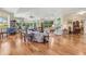 Inviting living room with hardwood floors, comfortable seating, and picturesque views at 203 Prestwick Dr, New Smyrna Beach, FL 32168