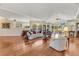 Spacious living room with hardwood floors, vaulted ceilings, and ample natural light at 203 Prestwick Dr, New Smyrna Beach, FL 32168